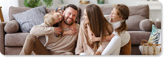 family smiling at each other